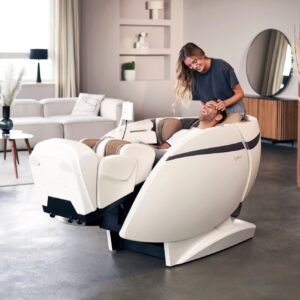 Man lies in massage chair Casada skyliner III - cream