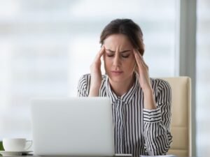 woman looking up what helps against headaches